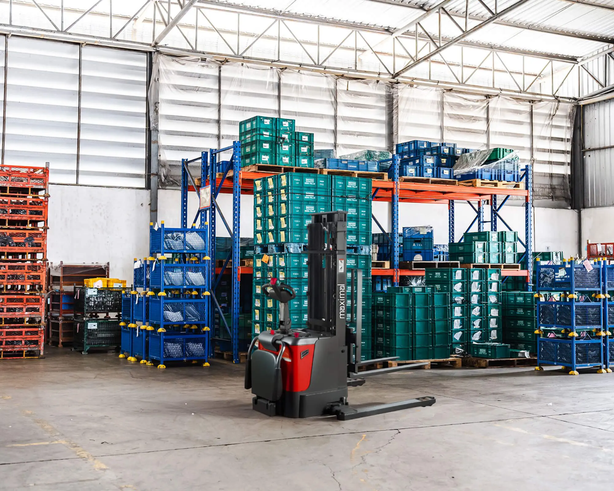Forklift in a Warehouse Loaded with Storage Bins A forklift positioned in a warehouse filled with stacked storage bins on shelves, showcasing an organized storage space.