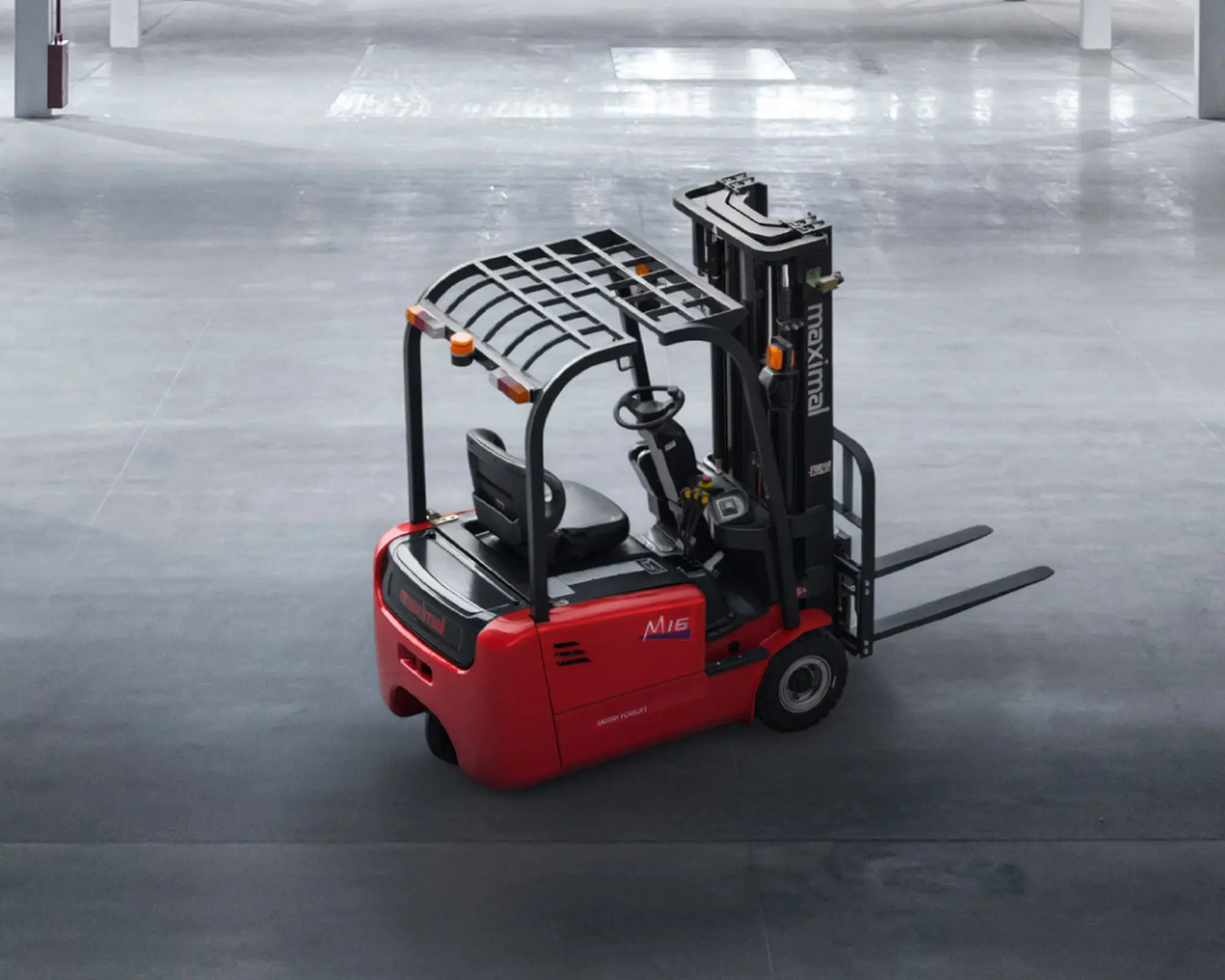 A red electric forklift positioned on a concrete floor in an industrial warehouse setting.