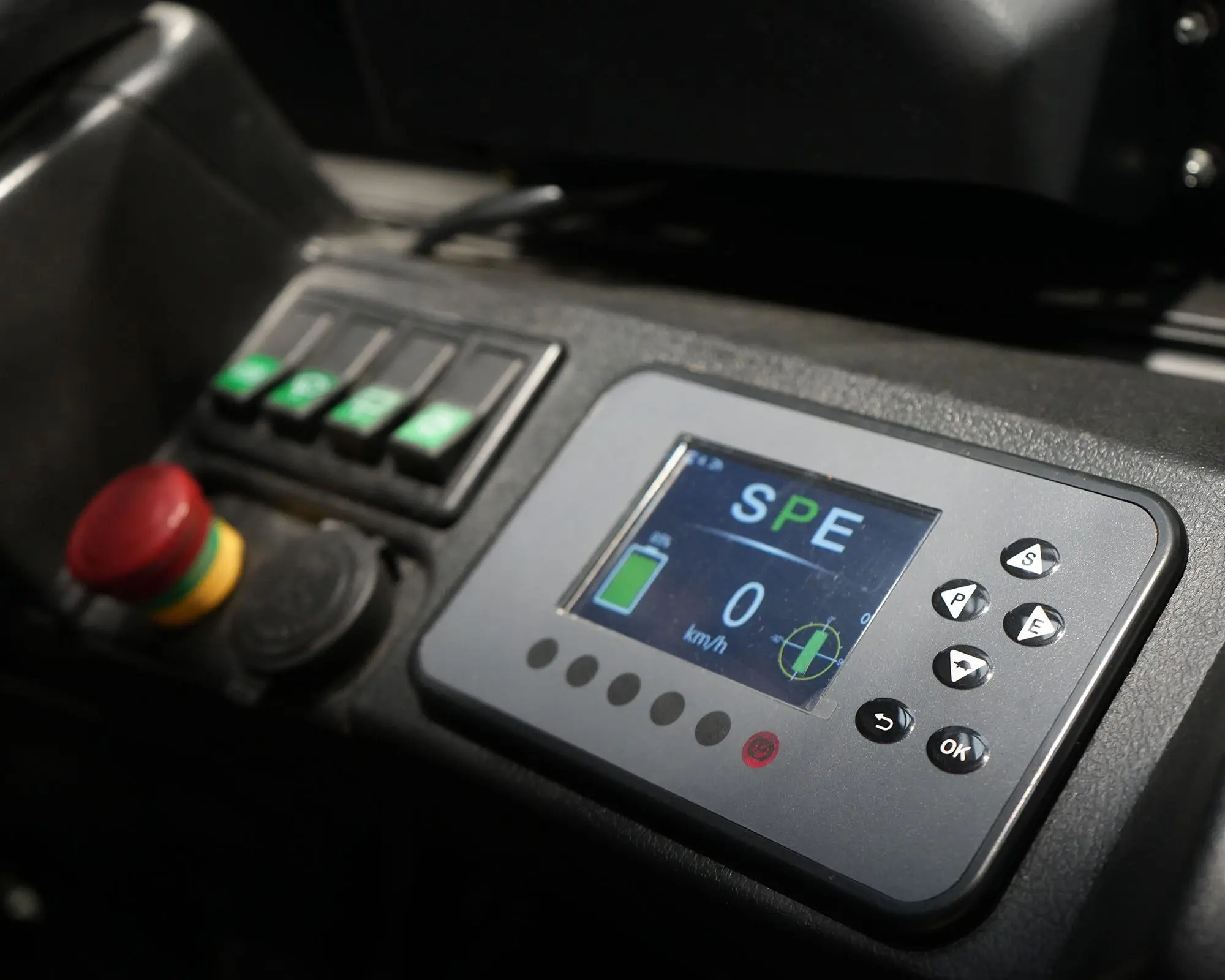 Close-up view of a control panel featuring a digital screen, buttons, and indicators.