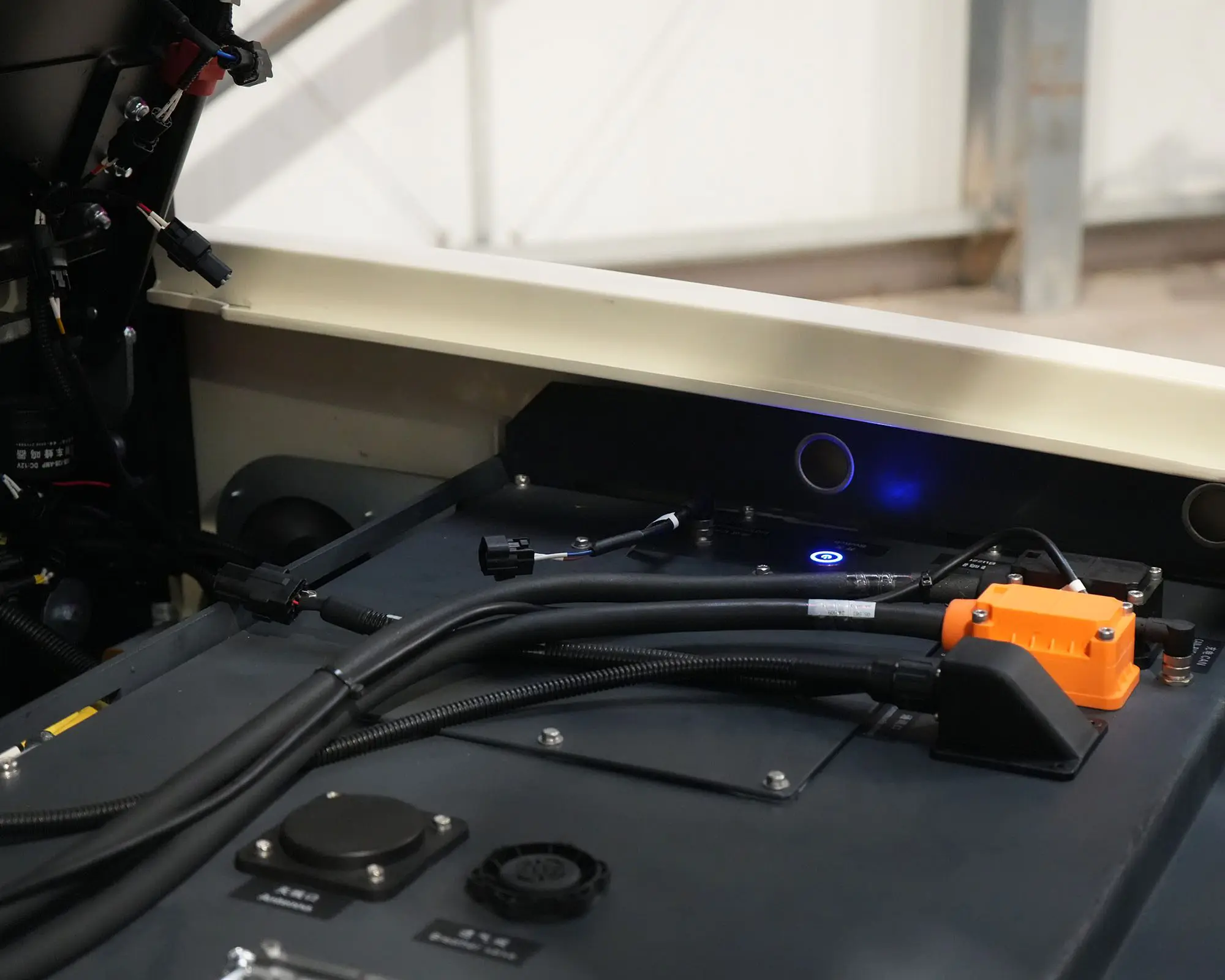 Detailed view of the electrical connections and cables in a piece of machinery.